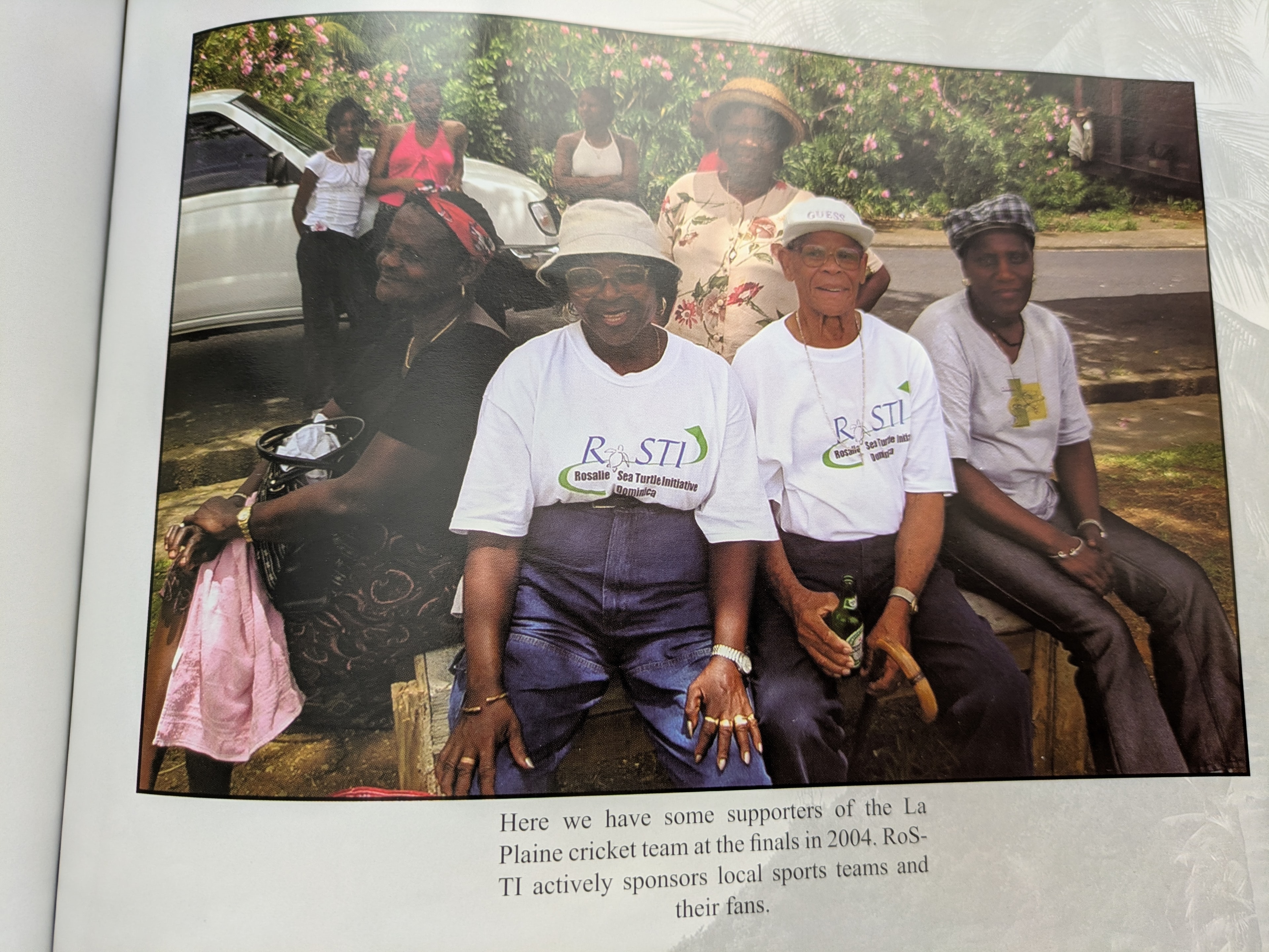 Supporters of the La Plaine cricket team at the finals in 2004, wearing RoSTI t-shirts — RoSTI actively sponsors local sports teams and their fans