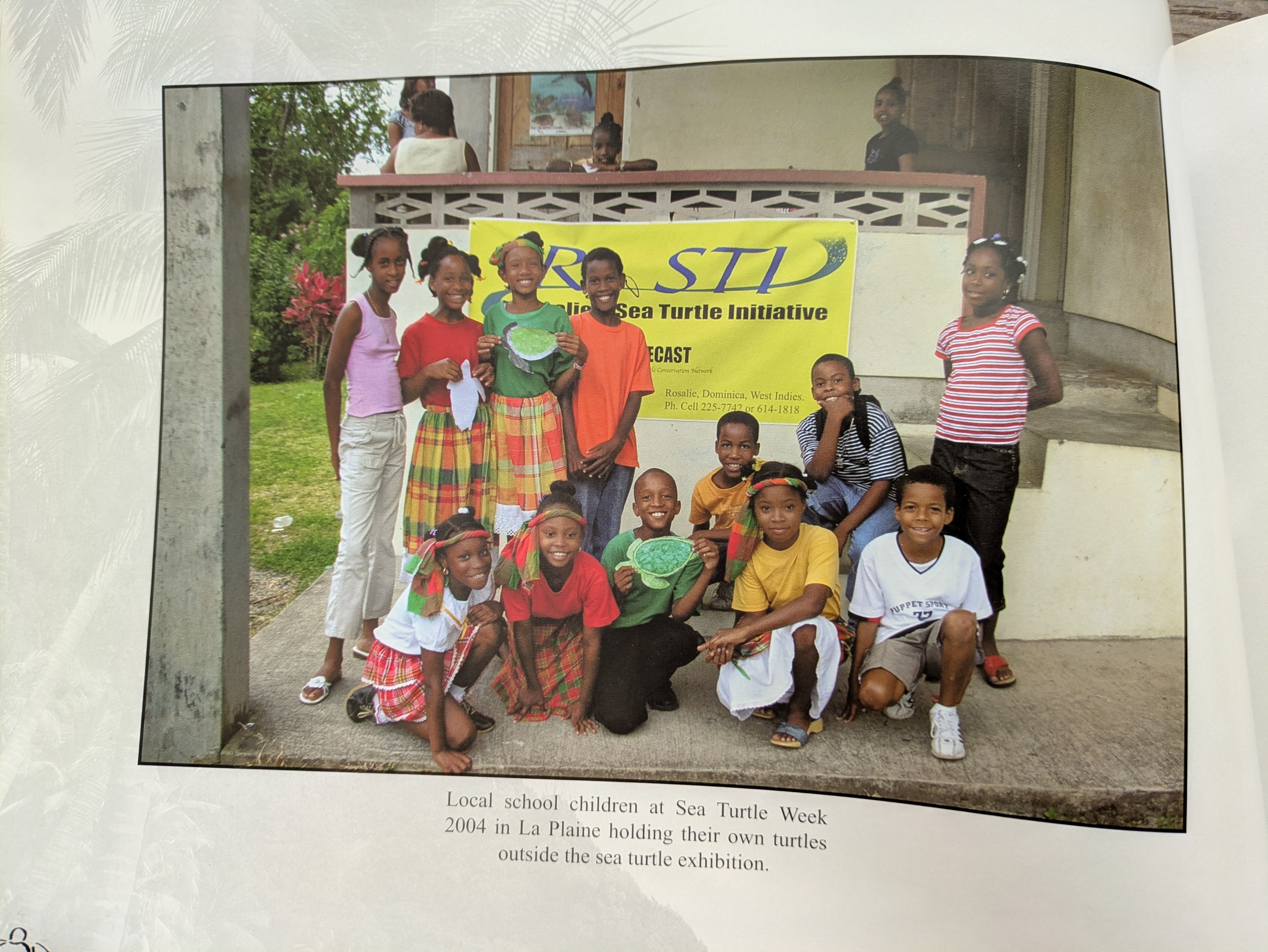 Local school children at Sea Turtle Week 2004 in La Plaine, holding their own turtles outside the sea turtle exhibition